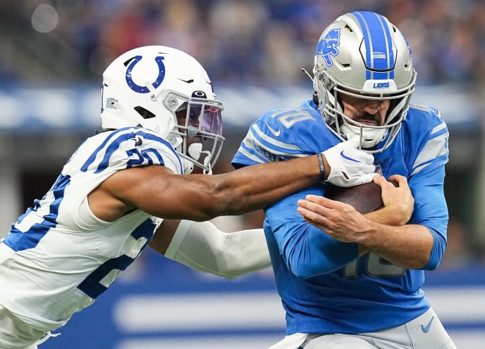 Detroit Lions quarterback David Blough (10) rushes up the Indianapolis Colts safety Nick Cross (20) on Saturday, August 20, 2022 at Lucas Oil Stadium in Indianapolis. The Indianapolis Colts and Detroit Lions are tied at the half, 13-13. Nfl Detroit Lions At Indianapolis Colts
